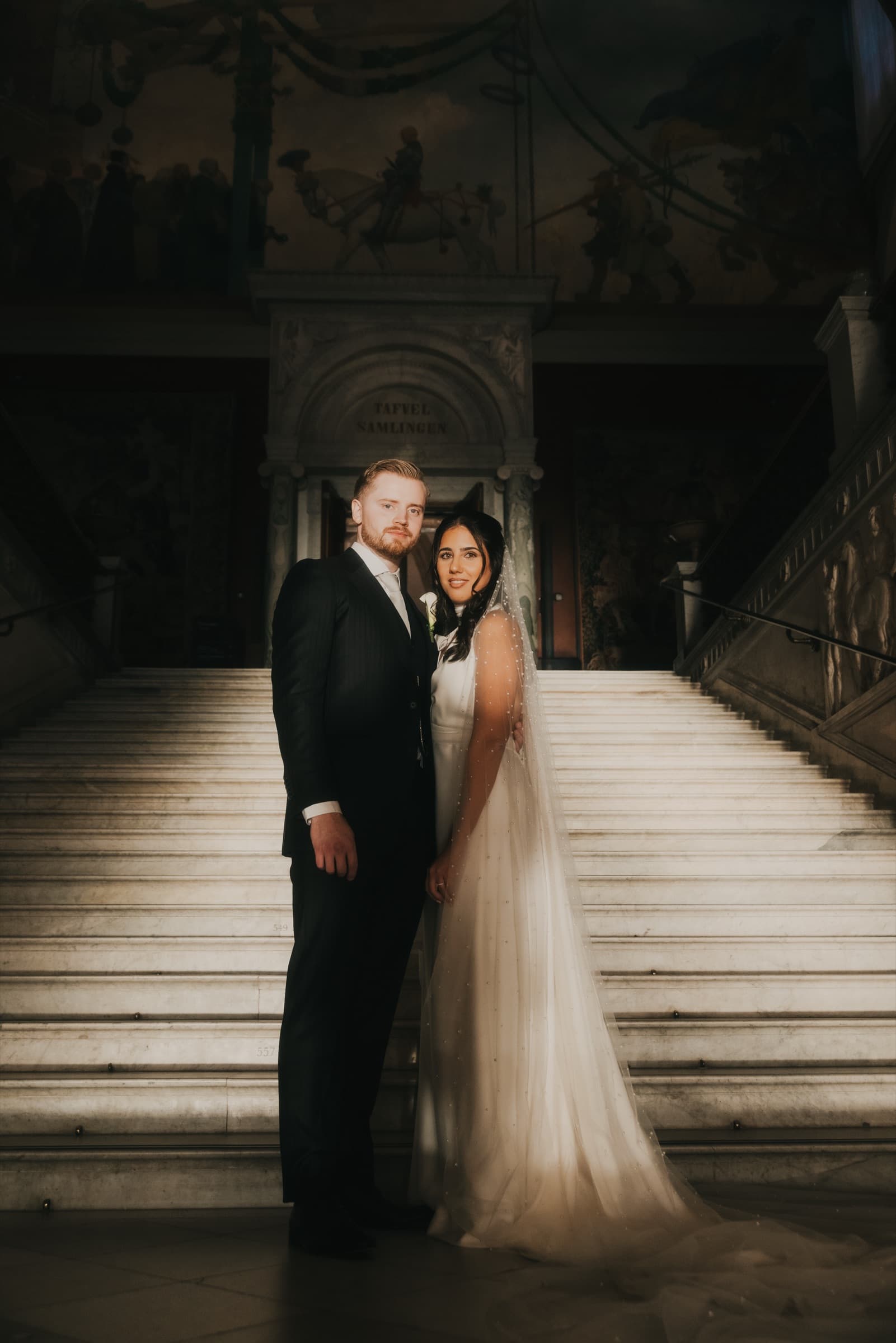 Couple on the staircase in moody evening light